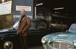 Jason Statham waits patiently for his Austin Healey to transform into a bank-robbing robot.