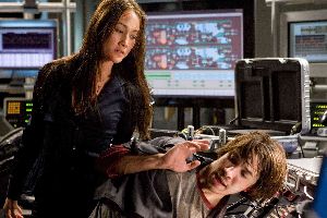 Maggie Q finds a new use for her trans-gender surgical addition - poking Justin Long in the back and pretending it's a gun.