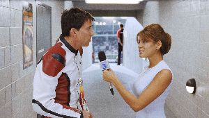 Nicolas Cage tries to warn Eva Mendes about the huge glow-worm climbing up the wall behind her.